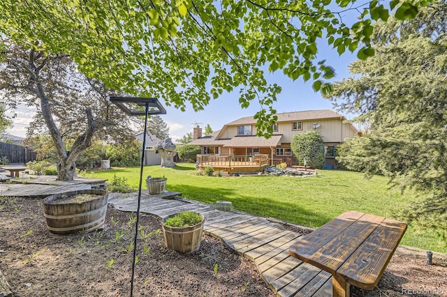 6708 W Portland Ave, Littleton, CO 80128 - view of green lawn with a deck