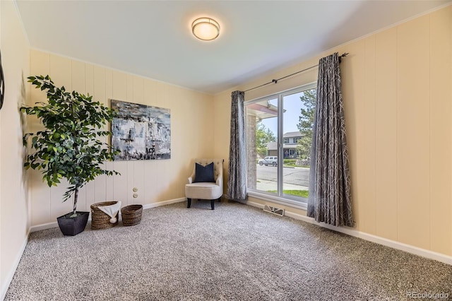 6708 W Portland Ave, Littleton, CO 80128 - living area with carpet flooring, baseboards, and a decorative wall
