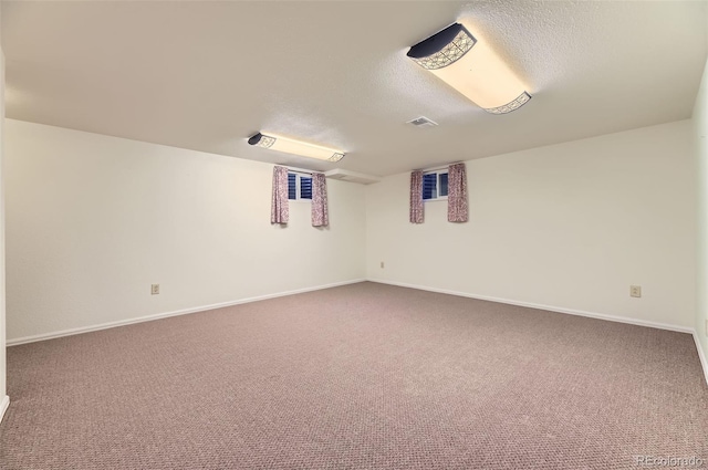 6708 W Portland Ave, Littleton, CO 80128 - finished below grade area with a textured ceiling, carpet floors, and baseboards