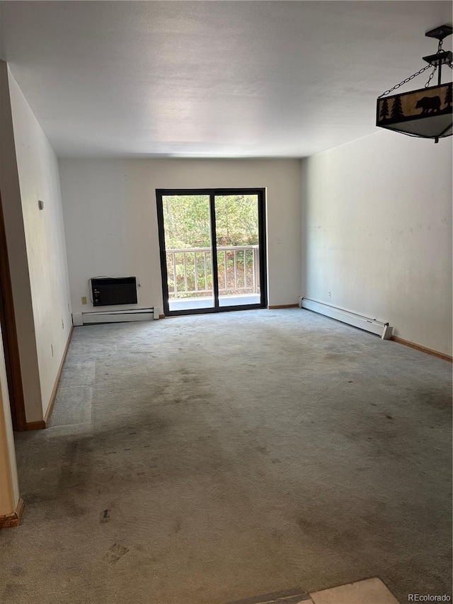 31270 John Wallace Rd Unit 306, Evergreen, CO 80439 - unfurnished living room with a baseboard radiator and carpet flooring