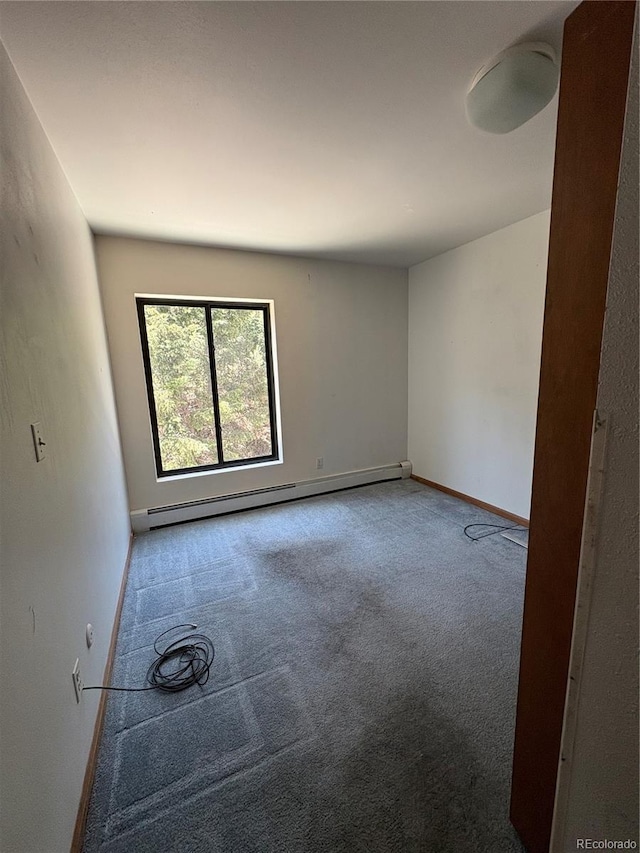 31270 John Wallace Rd Unit 306, Evergreen, CO 80439 - empty room featuring carpet flooring and a baseboard heating unit