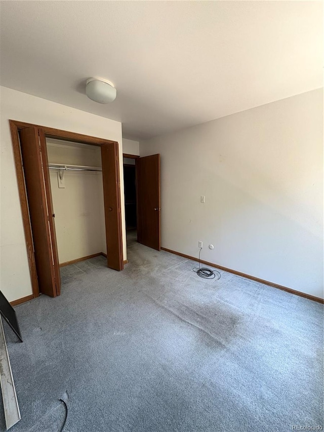 31270 John Wallace Rd Unit 306, Evergreen, CO 80439 - unfurnished bedroom with light carpet and a closet