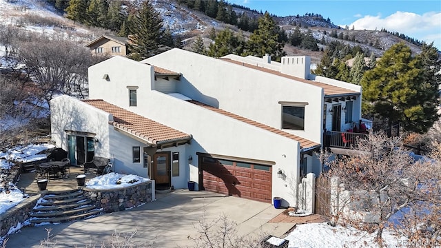 exterior space with a mountain view and a garage