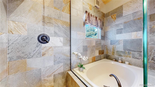 bathroom featuring separate shower and tub