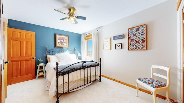 bedroom featuring ceiling fan and light colored carpet