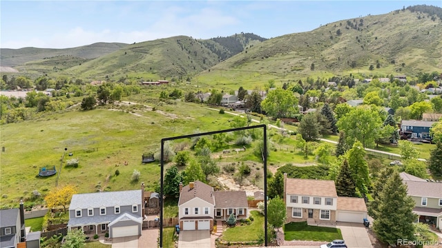 229 Berthoud Way, Golden, CO 80401 - aerial view of residential area featuring a mountainous background and property parcel outlined