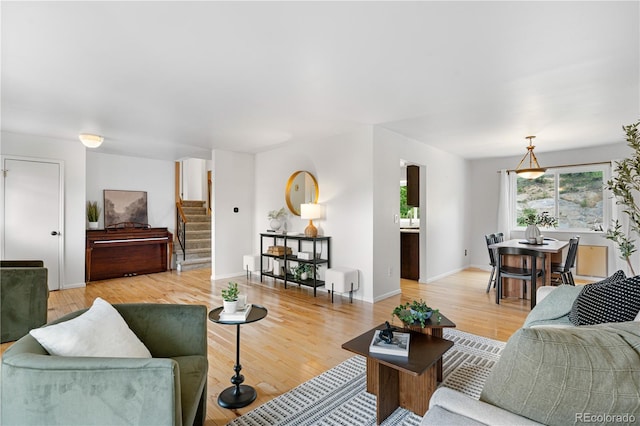 229 Berthoud Way, Golden, CO 80401 - living area featuring light wood finished floors and stairway