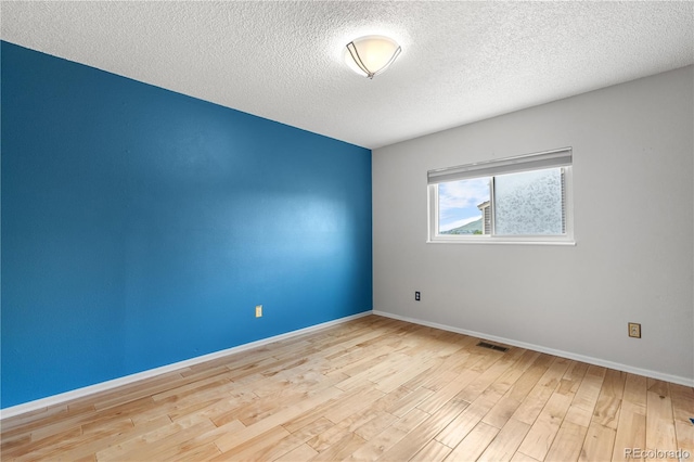229 Berthoud Way, Golden, CO 80401 - spare room with a textured ceiling and wood finished floors