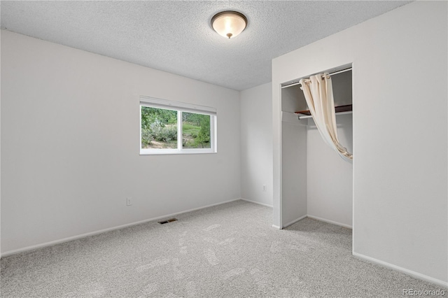 229 Berthoud Way, Golden, CO 80401 - unfurnished bedroom featuring carpet flooring, a textured ceiling, and a closet