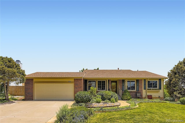 702 Windmill Pl, Highlands Ranch, CO 80126 - single story home featuring an attached garage, driveway, and brick siding
