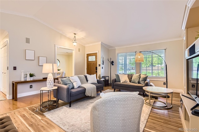 702 Windmill Pl, Highlands Ranch, CO 80126 - living area featuring wood finished floors, crown molding, and vaulted ceiling
