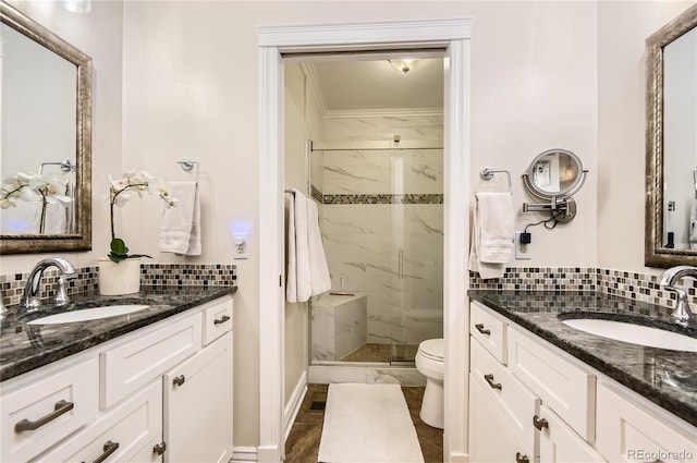 702 Windmill Pl, Highlands Ranch, CO 80126 - full bathroom featuring marble finish floors, a marble finish shower, two vanities, and ornamental molding