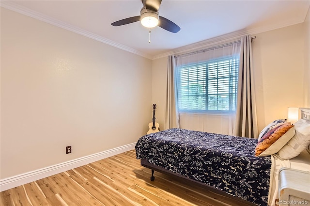 702 Windmill Pl, Highlands Ranch, CO 80126 - bedroom with crown molding, wood finished floors, and ceiling fan