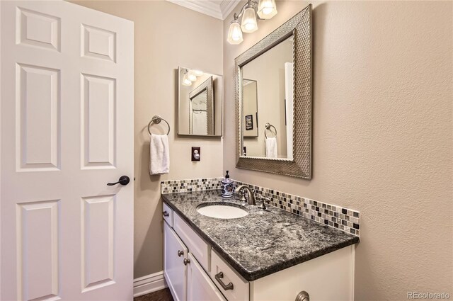 702 Windmill Pl, Highlands Ranch, CO 80126 - bathroom featuring vanity and ornamental molding