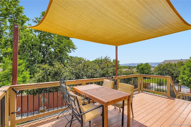 702 Windmill Pl, Highlands Ranch, CO 80126 - wooden terrace with outdoor dining space and a mountain view