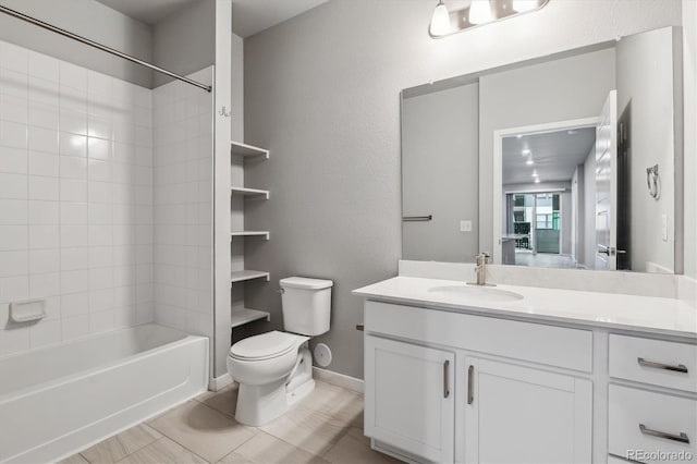 bathroom featuring baseboards, a textured wall, toilet, shower / tub combination, and vanity