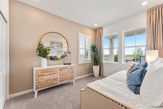 carpeted bedroom with baseboards and recessed lighting