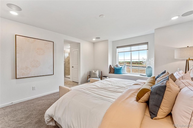 carpeted bedroom featuring recessed lighting and baseboards