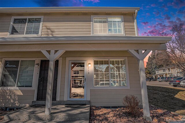 property entrance featuring a porch