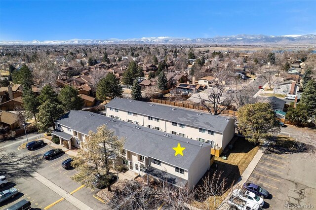 birds eye view of property with a mountain view and a residential view