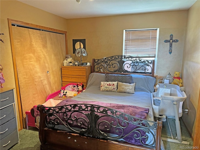 carpeted bedroom with a closet