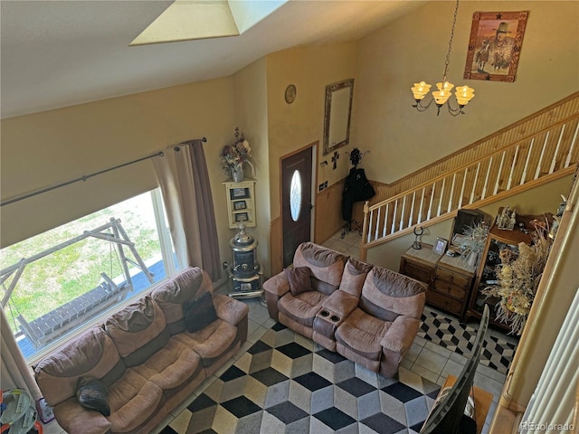 living room featuring a chandelier, tile patterned floors, and high vaulted ceiling