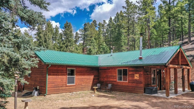 155 Squilchuck Trl, Woodland Park, CO 80863 - back of house with a patio and metal roof