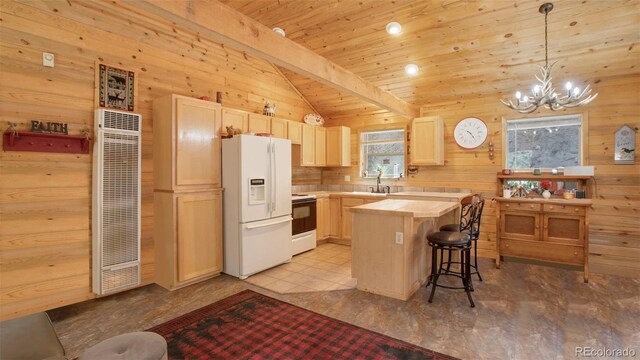 155 Squilchuck Trl, Woodland Park, CO 80863 - kitchen featuring a heating unit, a breakfast bar, white appliances, tile counters, and a notable chandelier