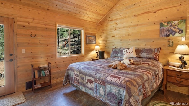 155 Squilchuck Trl, Woodland Park, CO 80863 - bedroom featuring wooden walls, wood ceiling, wood finished floors, and lofted ceiling