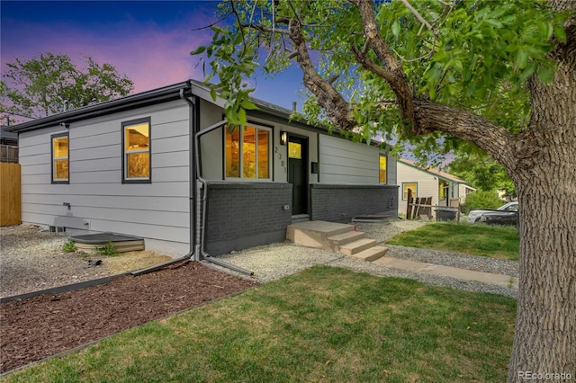 2701 Barnhart St, Thornton, CO 80229 - view of front of home featuring brick siding