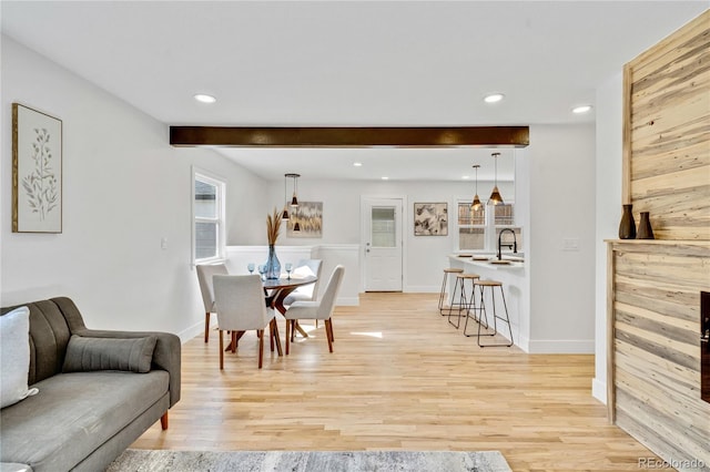 2701 Barnhart St, Thornton, CO 80229 - dining area featuring recessed lighting, light wood-style floors, beam ceiling, and baseboards