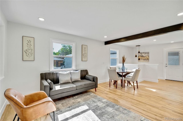 2701 Barnhart St, Thornton, CO 80229 - living area featuring plenty of natural light, light wood-style flooring, recessed lighting, baseboards, and beam ceiling