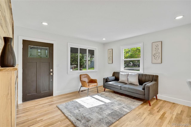 2701 Barnhart St, Thornton, CO 80229 - living room featuring baseboards, wood finished floors, and recessed lighting
