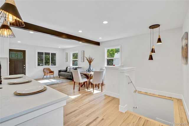 2701 Barnhart St, Thornton, CO 80229 - dining room with baseboards, light wood finished floors, recessed lighting, and beamed ceiling