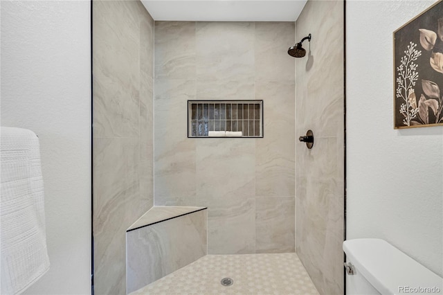 2701 Barnhart St, Thornton, CO 80229 - bathroom with toilet and a tile shower