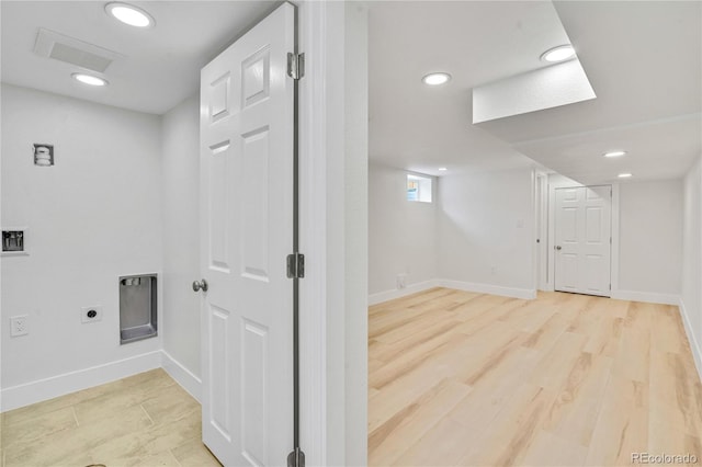 2701 Barnhart St, Thornton, CO 80229 - washroom with baseboards, hookup for an electric dryer, recessed lighting, and light wood finished floors