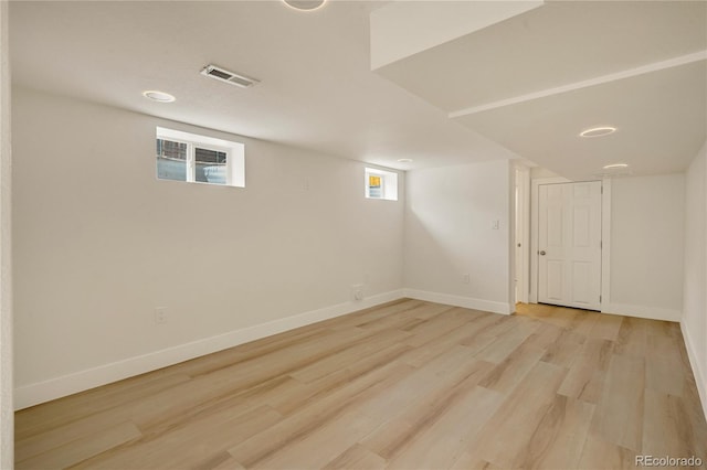 2701 Barnhart St, Thornton, CO 80229 - basement with light wood finished floors and baseboards