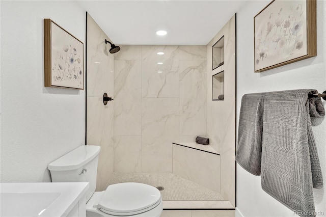 2701 Barnhart St, Thornton, CO 80229 - full bath with toilet, a marble finish shower, and recessed lighting