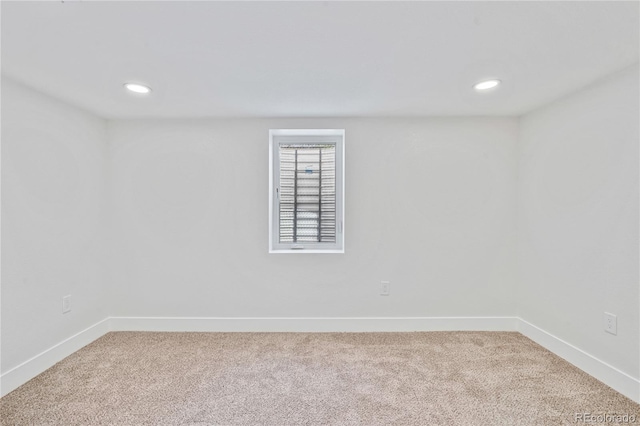 2701 Barnhart St, Thornton, CO 80229 - spare room featuring light colored carpet, baseboards, and recessed lighting