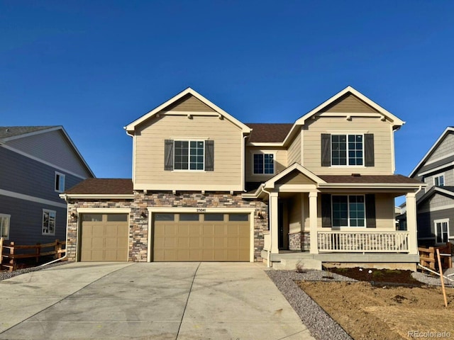 craftsman inspired home featuring a porch and a garage