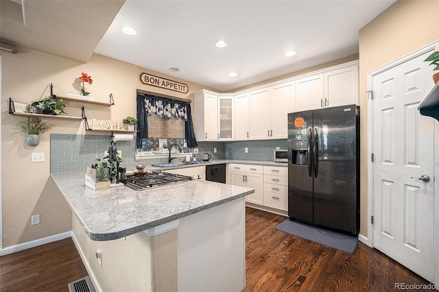 12051 E Lake Cir, Greenwood Village, CO 80111 - kitchen with refrigerator with ice dispenser, dishwasher, a peninsula, stainless steel gas cooktop, and white cabinetry