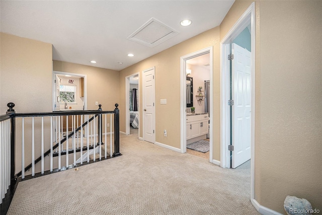 12051 E Lake Cir, Greenwood Village, CO 80111 - hall with an upstairs landing, light carpet, recessed lighting, and attic access
