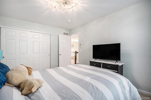 12051 E Lake Cir, Greenwood Village, CO 80111 - carpeted bedroom featuring a closet and baseboards