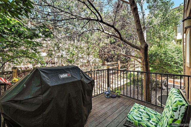 12051 E Lake Cir, Greenwood Village, CO 80111 - wooden deck featuring a grill