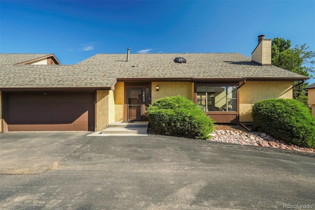 single story home with a garage