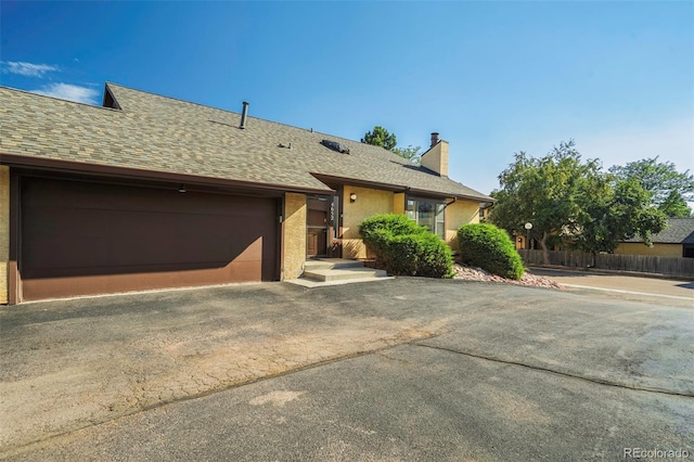 view of front of property featuring a garage