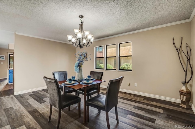 dining room with a textured ceiling, crown molding, a notable chandelier, and dark hardwood / wood-style flooring