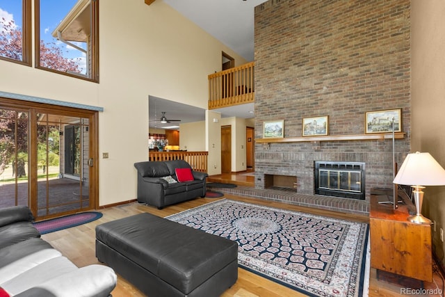 living room with a fireplace and light wood-type flooring