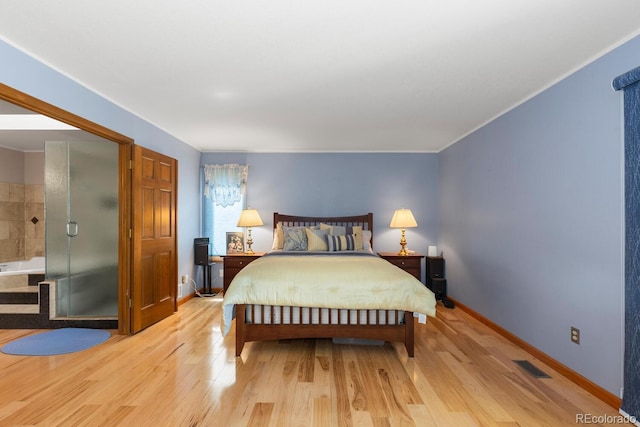 bedroom with light hardwood / wood-style floors