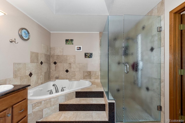 bathroom with vanity and separate shower and tub